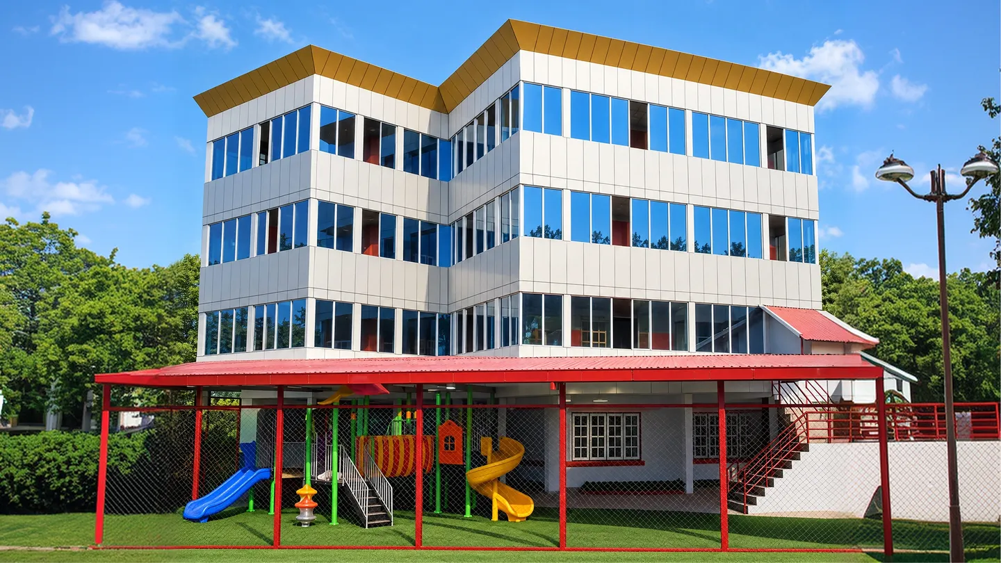 Adhyayan School building with the covered playground in front